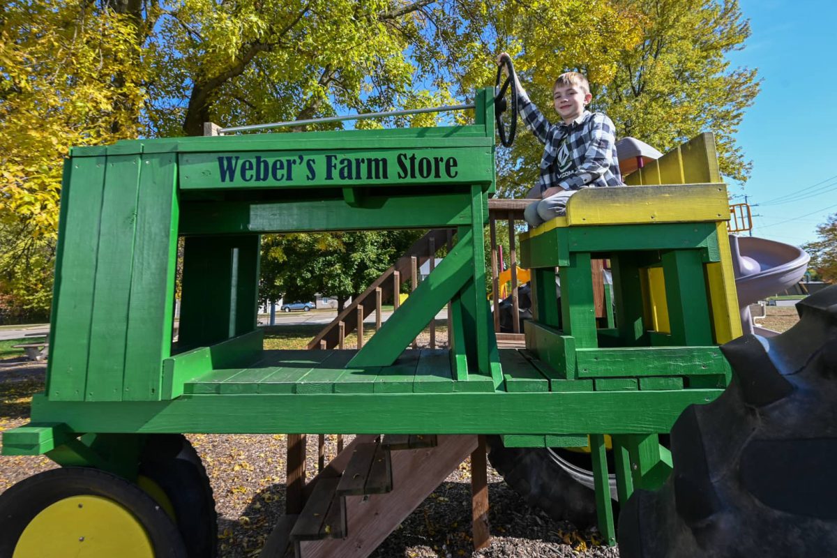 Fun fall attractions in and around Marshfield | Boy on tractor at Weberโs Farm Store Marshfield WI
