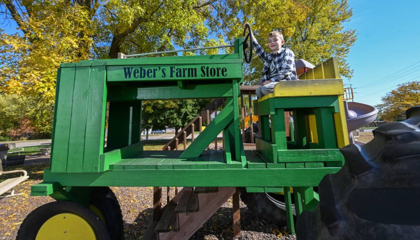 Boy on tractor at Weber’s Farm Store Marshfield WI